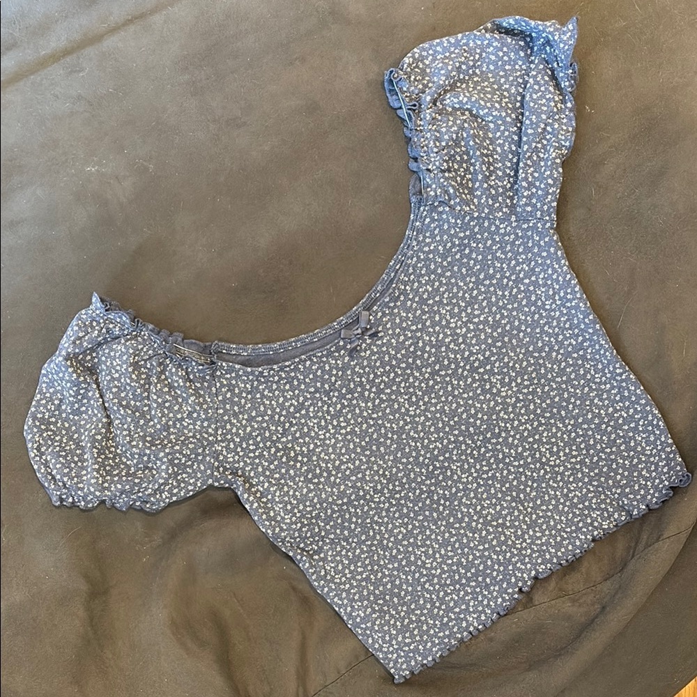 Cute dusty blue knit off the shoulder top, with mini white flowers and bow.
